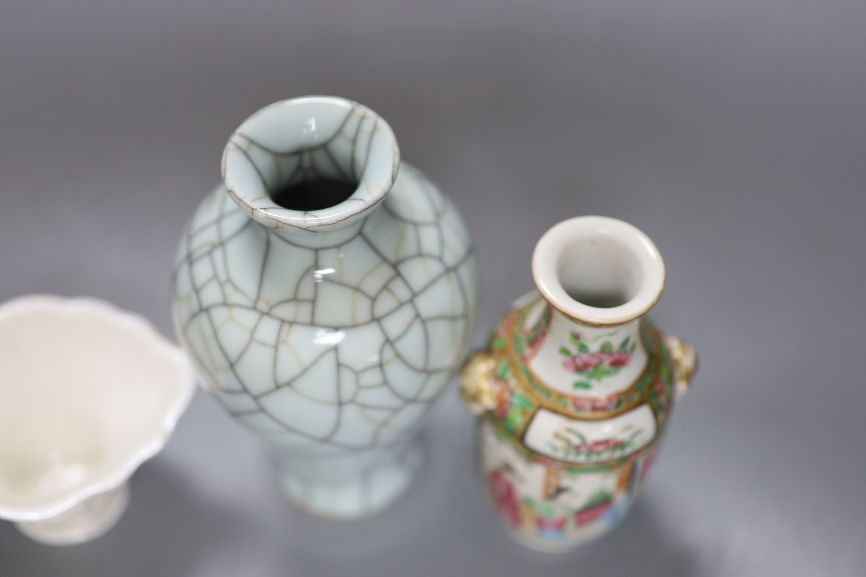 A Chinese white glazed libation cup, a similar famille rose vase and a crackle glaze vase, tallest 16cm